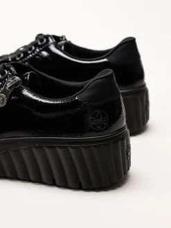 Rieker - Svarta platåsneakers i skinn-lack